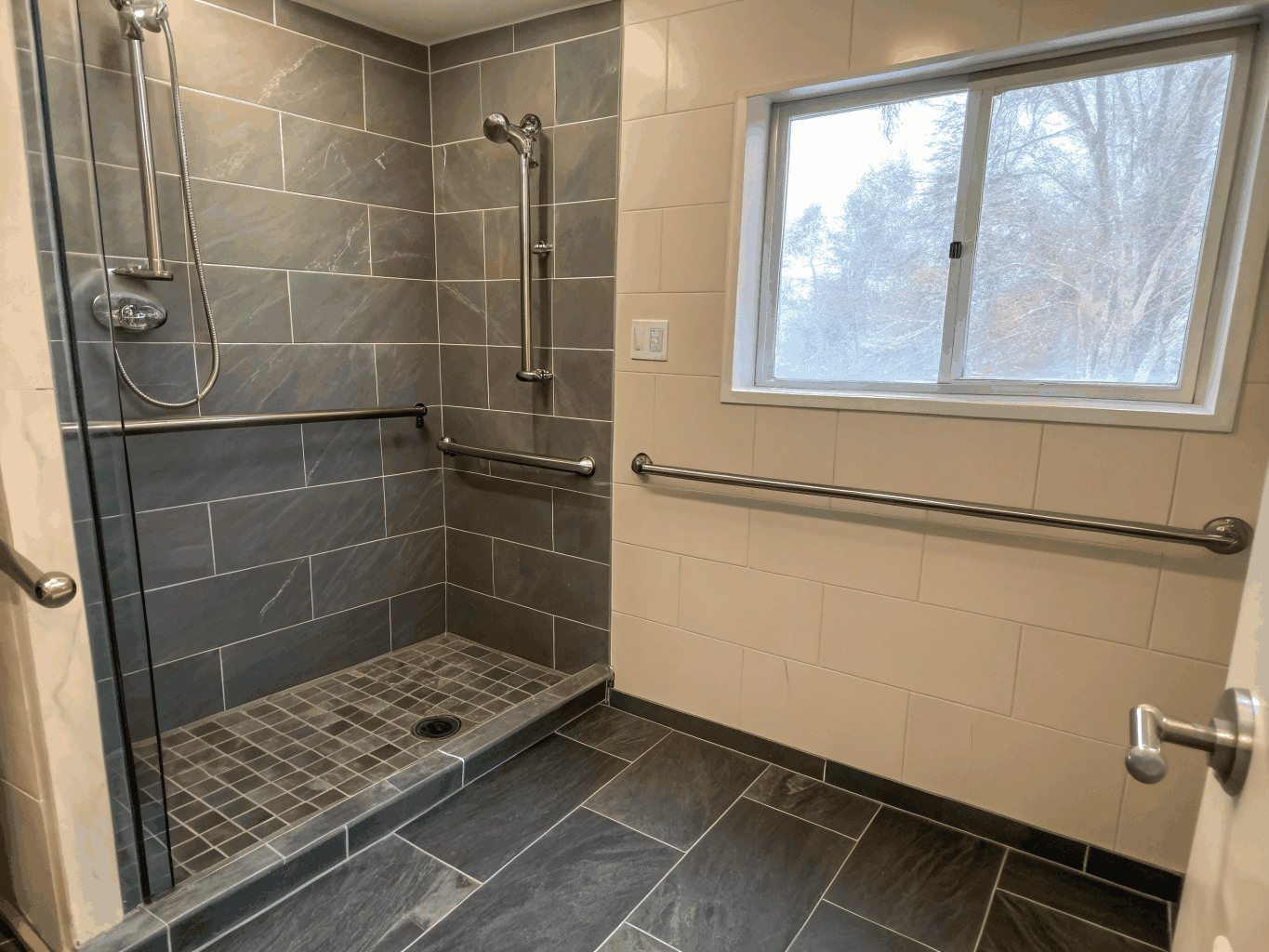 Universal design accessible bathroom remodel with curbless shower and elegant grab bars