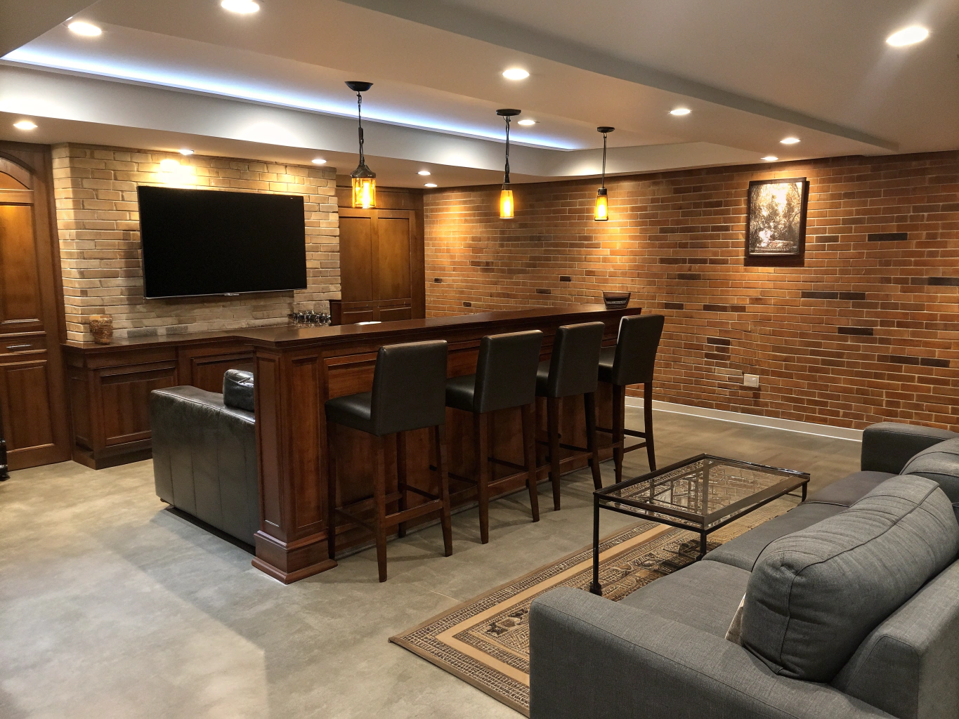 Finished modern basement entertainment lounge with custom wet bar